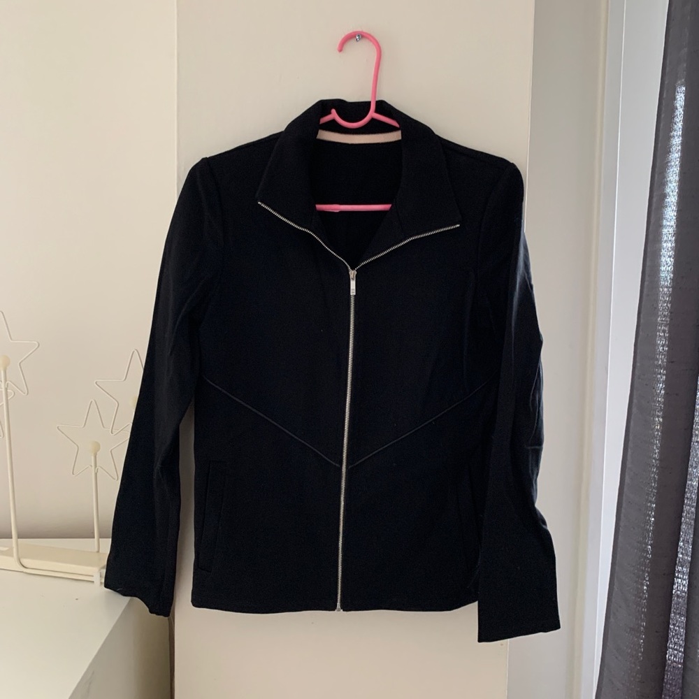 Black front zipper jacket side pocket